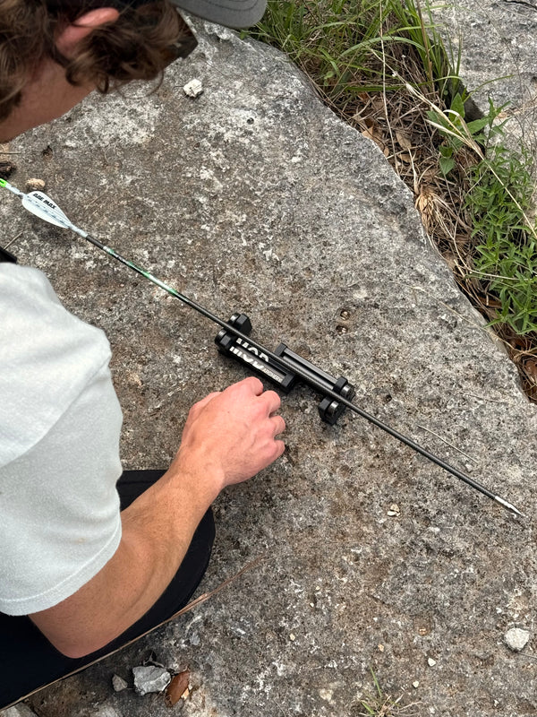 the spinex arrow spinner being used to check an arrow