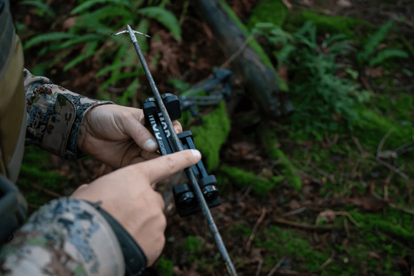 man using the collapsible arrow spinner, spinex, out in the woods