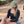 Woman wearing a green mod archery rope hat