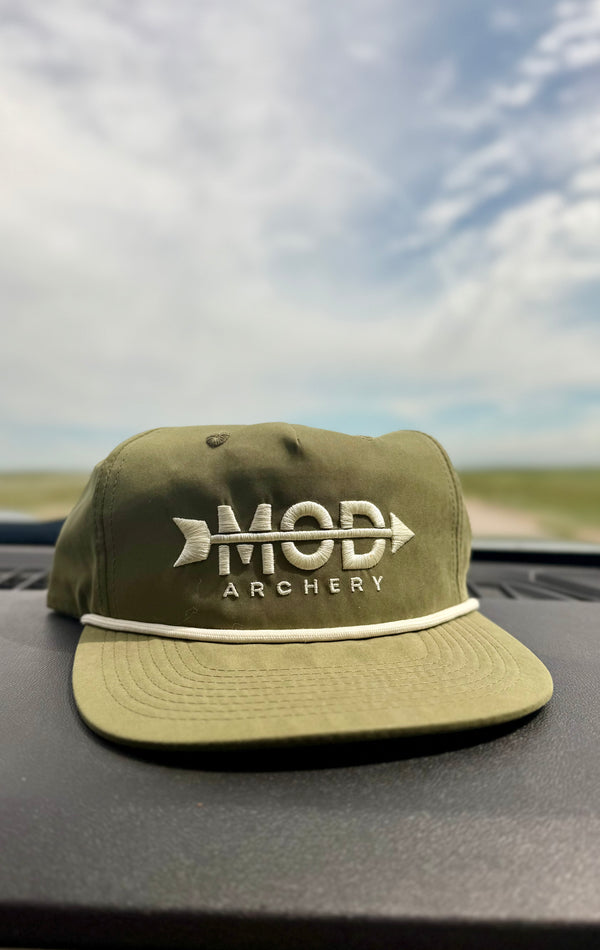 a green mod archery rope hat on the dash