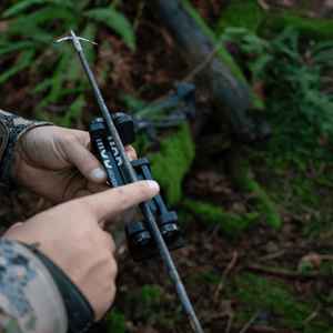 man using the collapsible arrow spinner, spinex, out in the woods