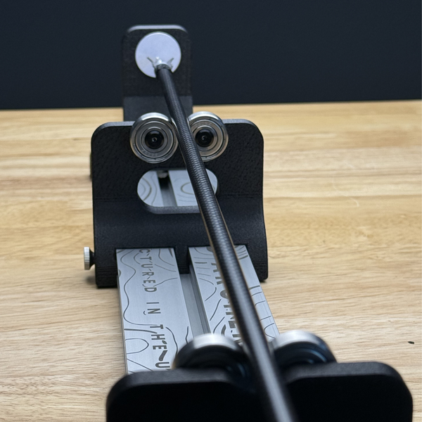 tabletop arrow spinner by mod archery shown testing broadhead alignment 